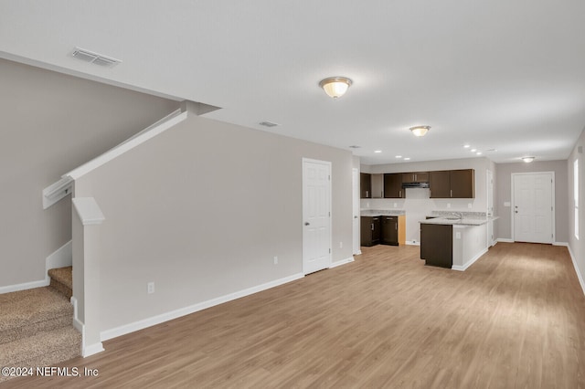 unfurnished living room with light hardwood / wood-style floors