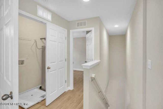 bathroom with hardwood / wood-style flooring