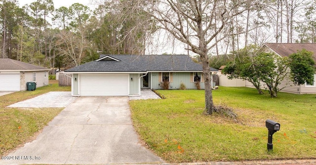 ranch-style home with a garage and a front lawn