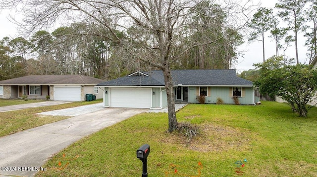 ranch-style house with a front yard and a garage