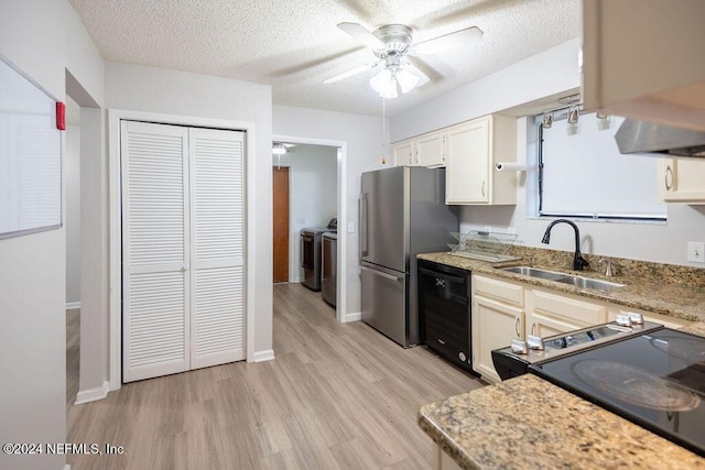 kitchen with dishwasher, sink, independent washer and dryer, a textured ceiling, and stainless steel refrigerator