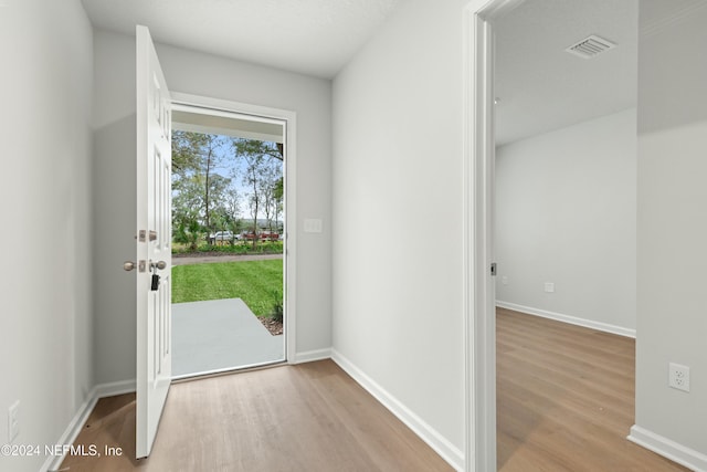 doorway to outside with light hardwood / wood-style floors