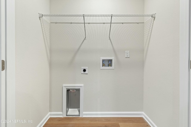 laundry area featuring hookup for an electric dryer, wood-type flooring, and hookup for a washing machine