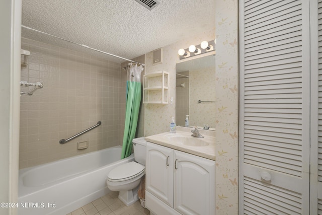 full bathroom featuring shower / bath combo, tile patterned floors, vanity, a textured ceiling, and toilet