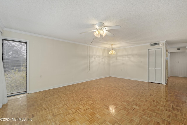 spare room with ceiling fan, a textured ceiling, and light parquet floors