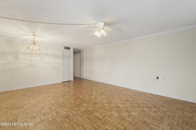 unfurnished room with a textured ceiling, parquet floors, crown molding, and ceiling fan