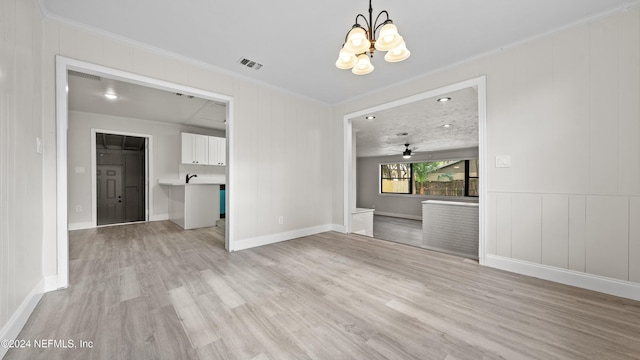 interior space with ceiling fan with notable chandelier, crown molding, and light hardwood / wood-style flooring