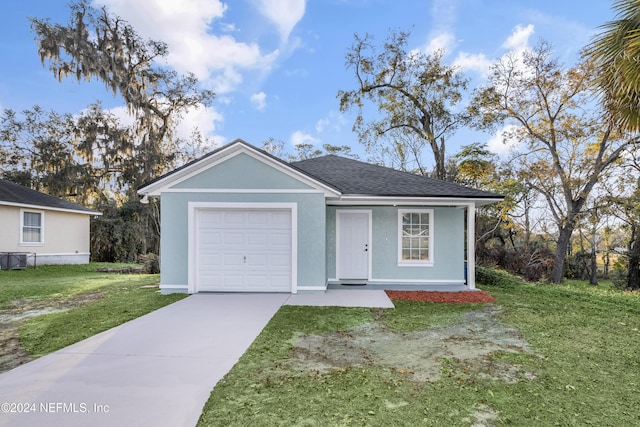 ranch-style home with a front yard and a garage