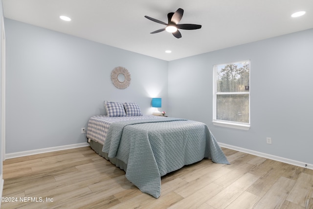 bedroom featuring ceiling fan and light wood-type flooring