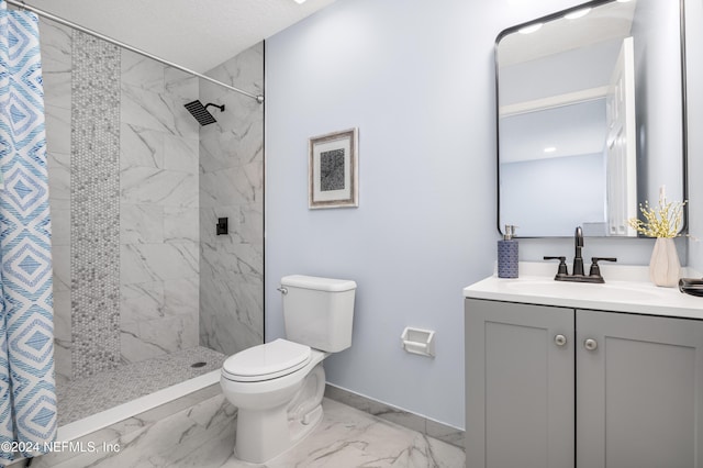 bathroom with a shower with curtain, vanity, toilet, and a textured ceiling