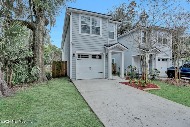 front facade with a garage and a front yard