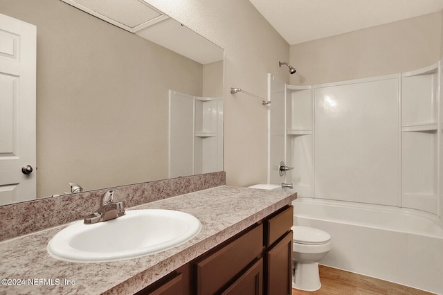 full bathroom featuring hardwood / wood-style floors, vanity, toilet, and shower / bath combination