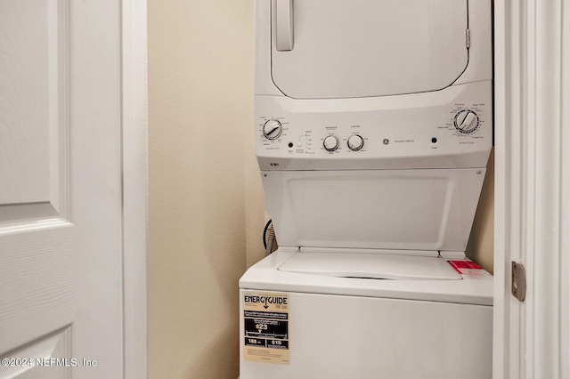 washroom with stacked washer and dryer