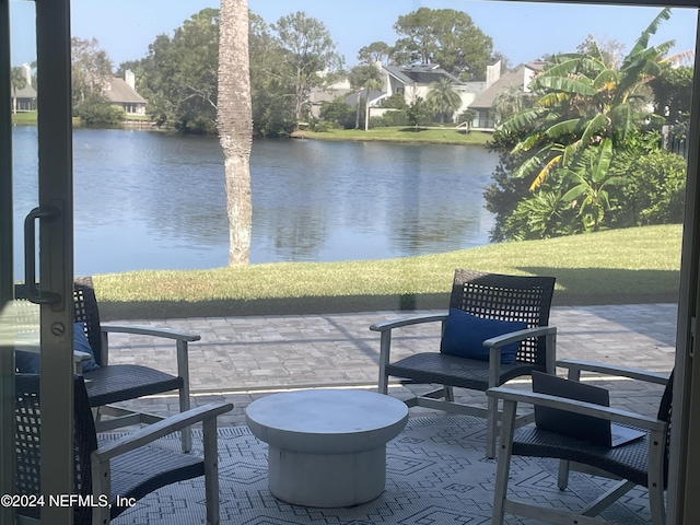 view of patio / terrace with a water view