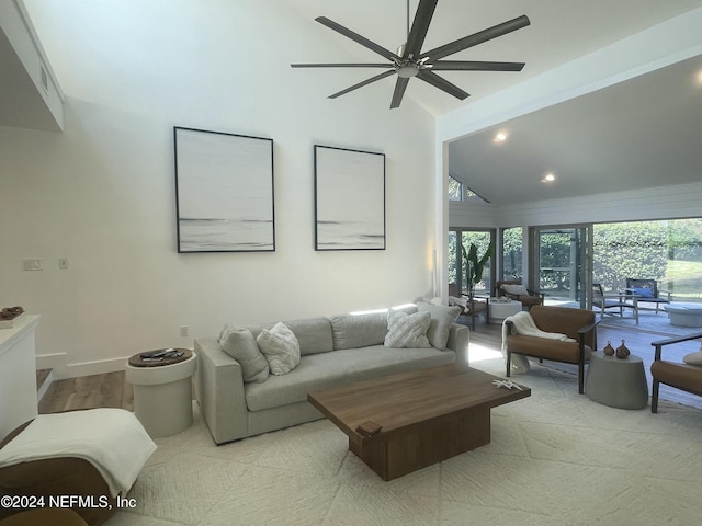 living room with ceiling fan and lofted ceiling