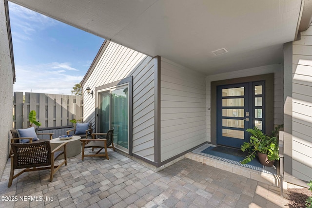 doorway to property featuring a patio