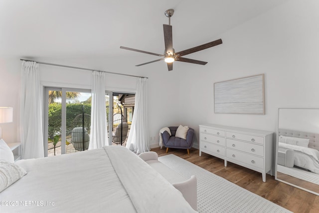 bedroom featuring dark wood-type flooring, ceiling fan, lofted ceiling, and access to outside