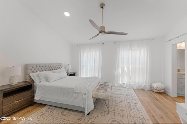 bedroom with lofted ceiling, light hardwood / wood-style floors, and ceiling fan