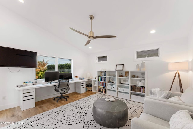 office featuring vaulted ceiling, ceiling fan, and light wood-type flooring