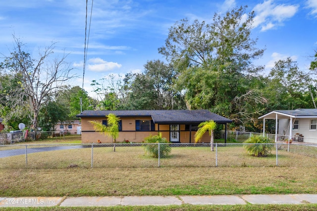 ranch-style home with a front lawn