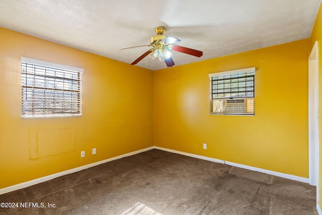 unfurnished room featuring carpet and ceiling fan