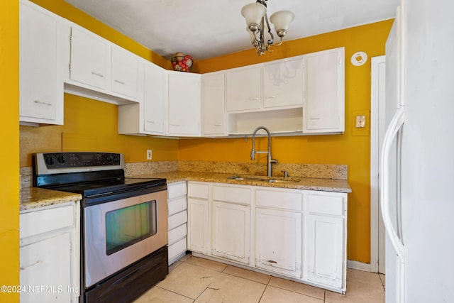 kitchen featuring white cabinets, sink, and stainless steel range with electric cooktop