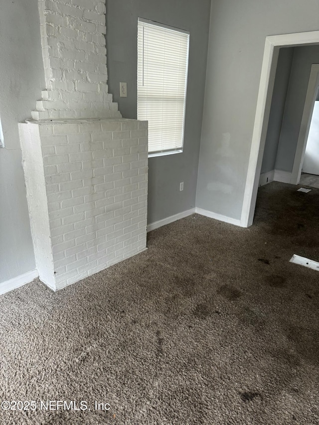 unfurnished living room with carpet