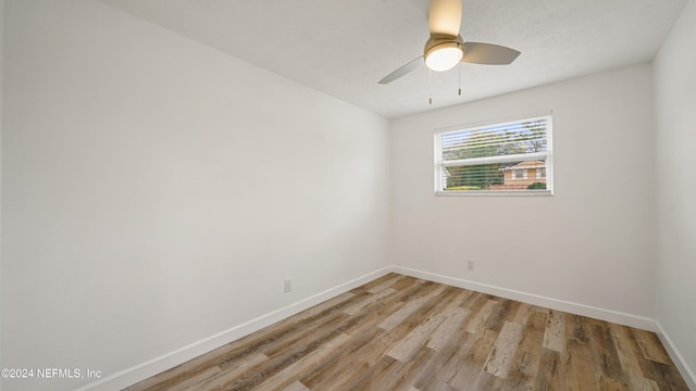 empty room featuring hardwood / wood-style flooring and ceiling fan