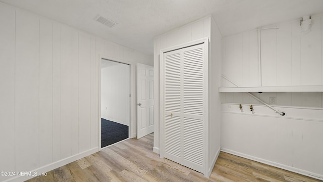 corridor featuring light hardwood / wood-style flooring