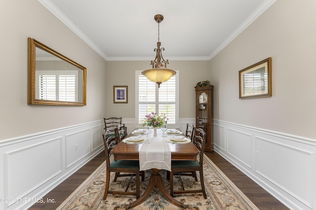 dining space featuring dark hardwood / wood-style floors and ornamental molding