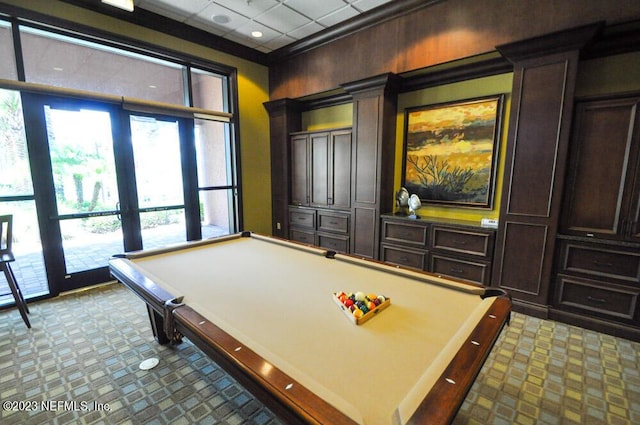 playroom with light carpet, ornamental molding, and billiards