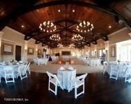 unfurnished dining area featuring lofted ceiling with beams and wood ceiling