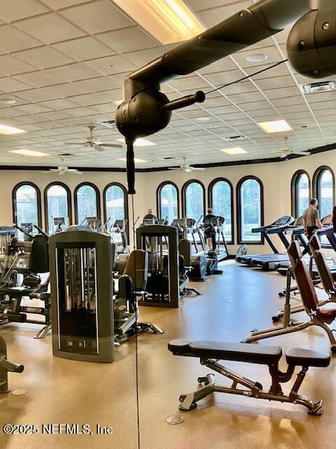 exercise room featuring a paneled ceiling