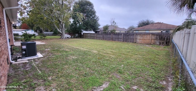 view of yard featuring central AC unit