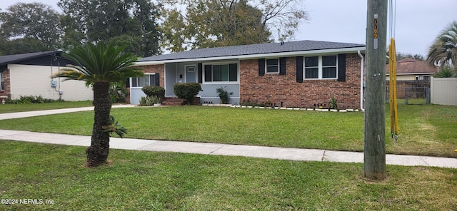 ranch-style house with a front lawn