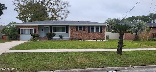 ranch-style house with a front lawn