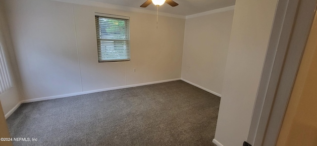 carpeted spare room featuring ceiling fan