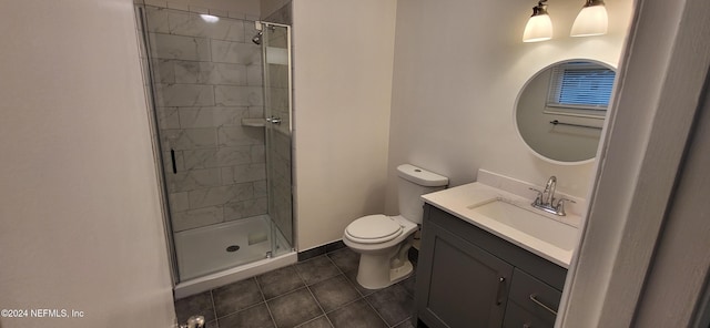 bathroom with walk in shower, tile patterned floors, vanity, and toilet