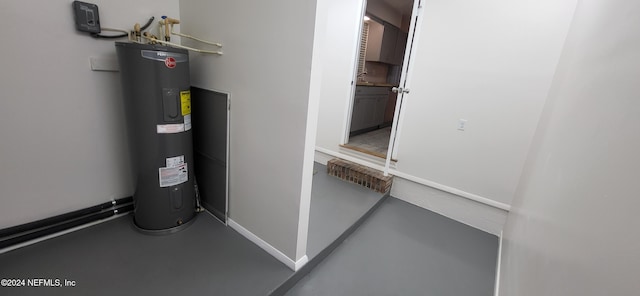 utility room featuring electric water heater