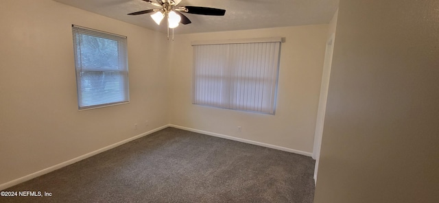 carpeted empty room featuring ceiling fan