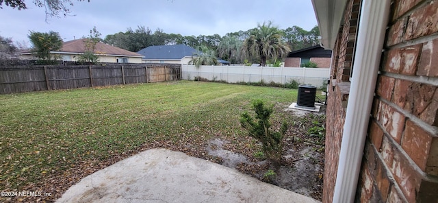 view of yard with central AC