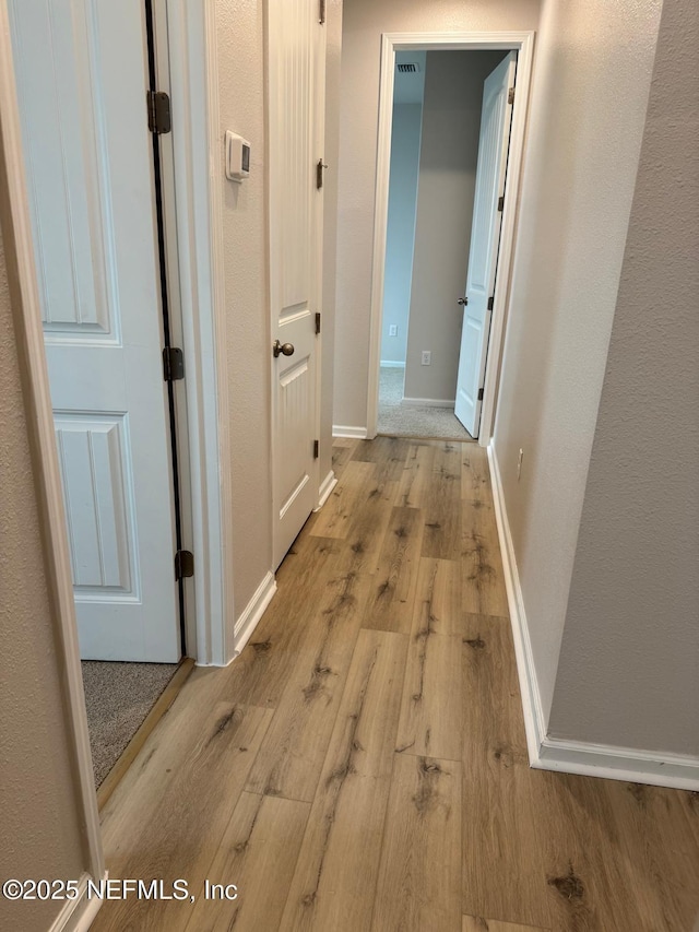 hallway featuring light wood-type flooring