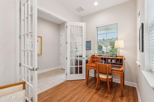 office featuring french doors and hardwood / wood-style floors