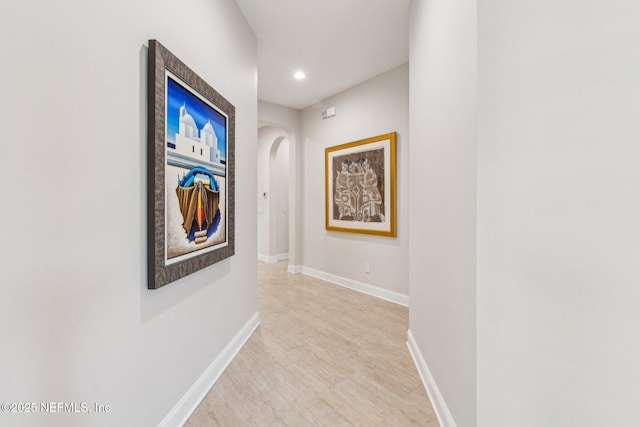 hallway with light wood-type flooring