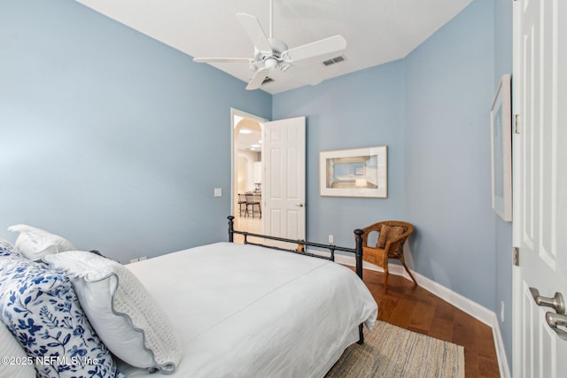 bedroom featuring hardwood / wood-style flooring and ceiling fan