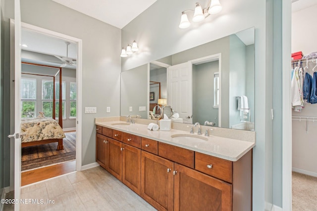 bathroom featuring vanity and ceiling fan