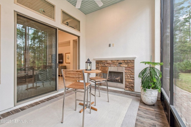 view of patio / terrace featuring a fireplace and ceiling fan