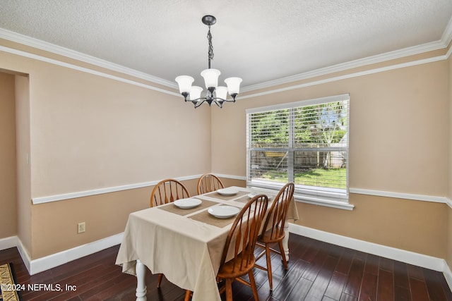 dining room featuring a textured ceiling, a notable chandelier, dark hardwood / wood-style floors, and ornamental molding