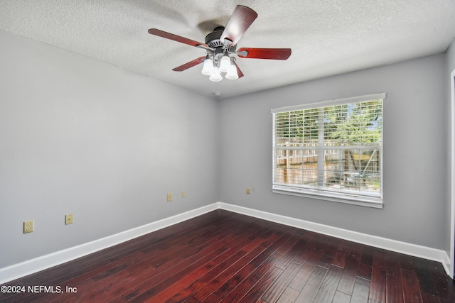 empty room featuring wood-type flooring and ceiling fan