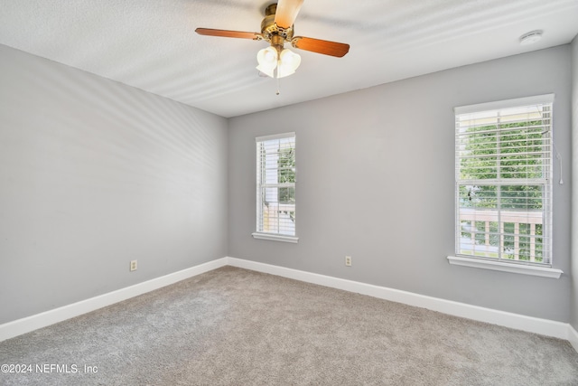 unfurnished room with carpet floors and ceiling fan